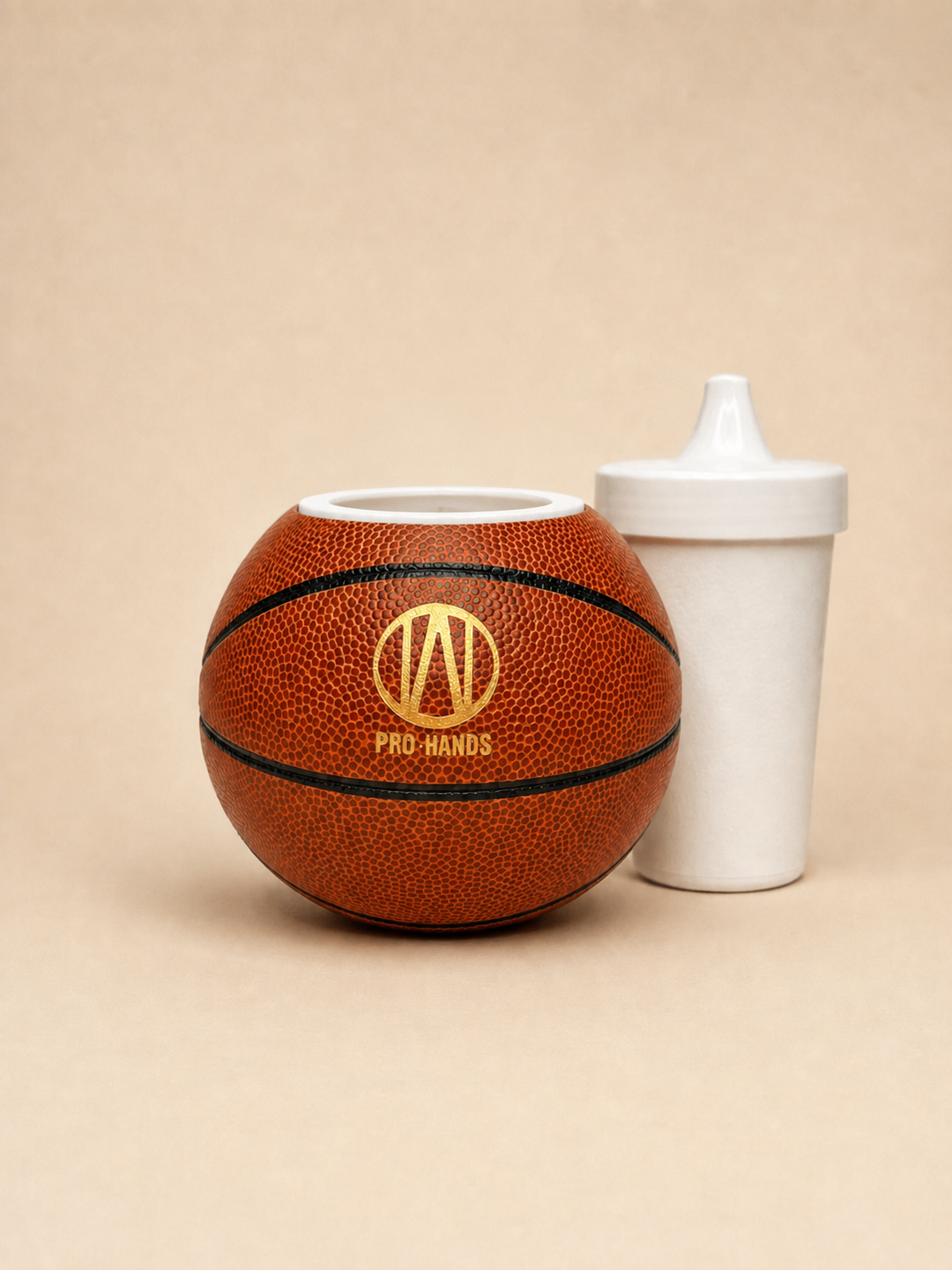 Pro-Hands toddler sippy cup system with patented sports-themed cup holder.
